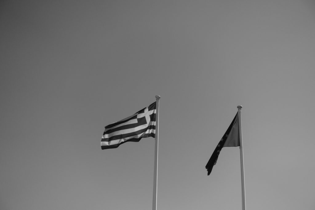 Flags of Greece and the EU in black and white