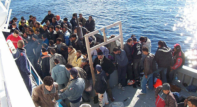 Photo of refugees on a beat in the Mediterranean
