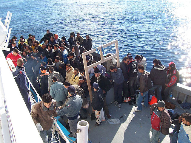 Photo of refugees on a beat in the Mediterranean