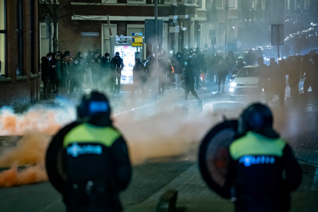 A large group of young people pelts the police present with stones and fireworks in Rotterdam, The Netherlands, 25 January 2021. EPA-EFE / Killian Lindenburg / MediaTV