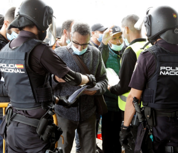 Members of the Spanish National Police check travelers upon arrival to Alicante, Spain, 22 October 2021. EPA-EFE/MORELL