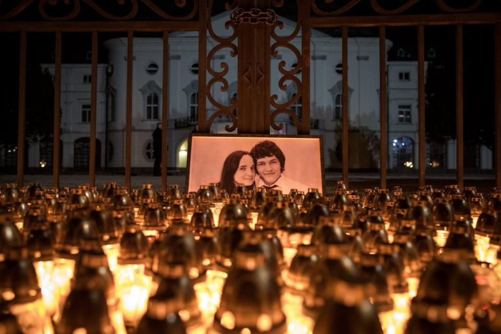 Candles are placed during a march in memory of murdered Slovak journalist Jan Kuciak and his fiancee Martina Kusnirova.