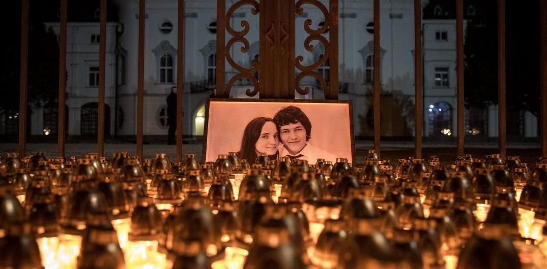 Candles are placed during a march in memory of murdered Slovak journalist Jan Kuciak and his fiancee Martina Kusnirova.