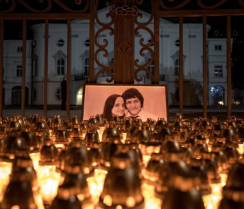 Candles are placed during a march in memory of murdered Slovak journalist Jan Kuciak and his fiancee Martina Kusnirova.