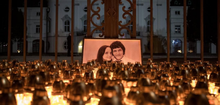 Candles are placed during a march in memory of murdered Slovak journalist Jan Kuciak and his fiancee Martina Kusnirova.