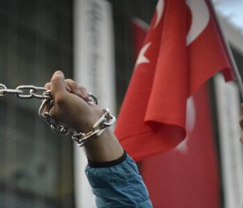 A protester chaining hands during freedom of the press in Istanbul, Turkey, 4 March 2016