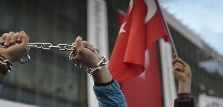 A protester chaining hands during freedom of the press in Istanbul, Turkey, 4 March 2016