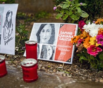 Flowers and light candles are put in memory of murdered journalist Daphne Caruana Galizia at a makeshift memorial outside the law courts in Valletta, Malta on November 25, 2019. (Photo by Emmanuele Contini/NurPhoto)