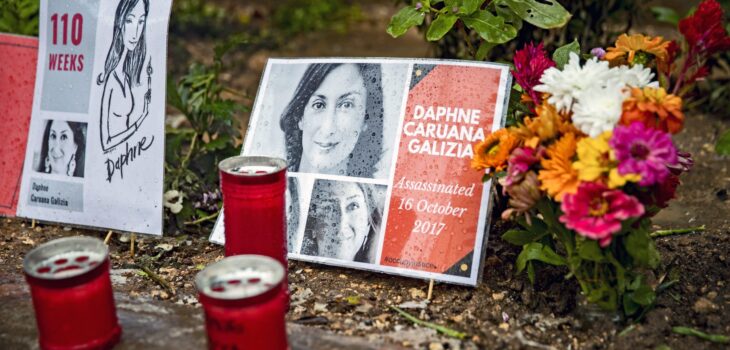 Flowers and light candles are put in memory of murdered journalist Daphne Caruana Galizia at a makeshift memorial outside the law courts in Valletta, Malta on November 25, 2019. (Photo by Emmanuele Contini/NurPhoto)