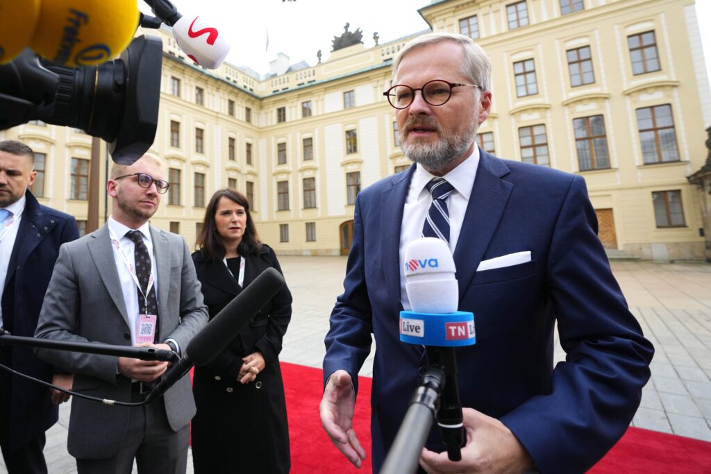 Czech Republic's Prime Minister Petr Fiala speaks with the media as he arrives for an EU Summit at Prague Castle in Prague, Czech Republic, Friday, Oct 7, 2022.