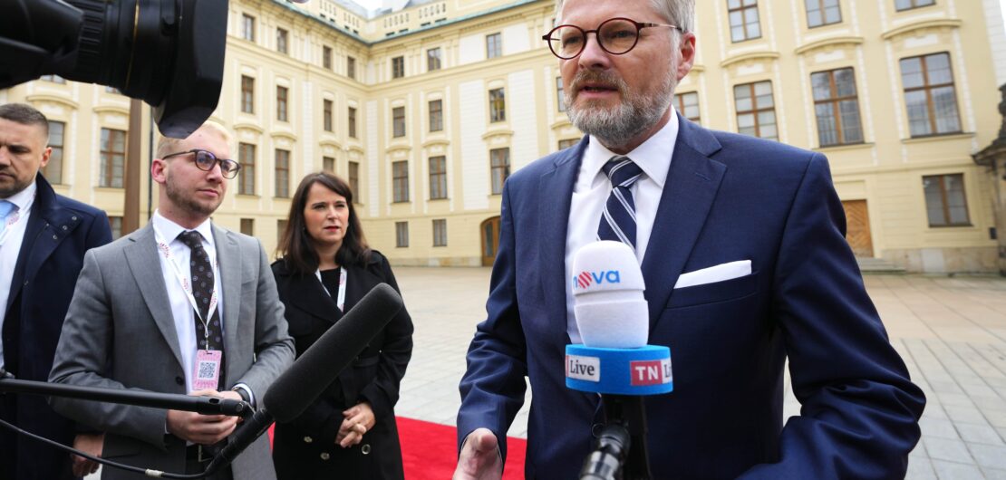 Czech Republic's Prime Minister Petr Fiala speaks with the media as he arrives for an EU Summit at Prague Castle in Prague, Czech Republic, Friday, Oct 7, 2022.